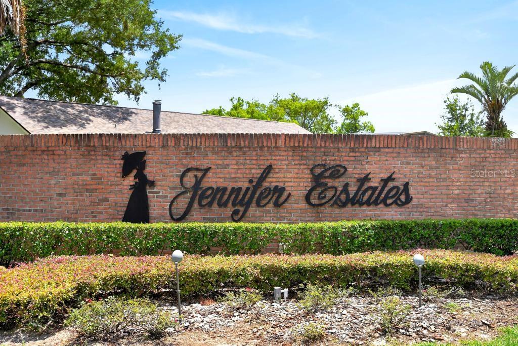 A brick wall displays the name Jennifer Estates with a silhouette of a woman — 2670 JENNIFER HOPE BOULEVARD, LONGWOOD, FL