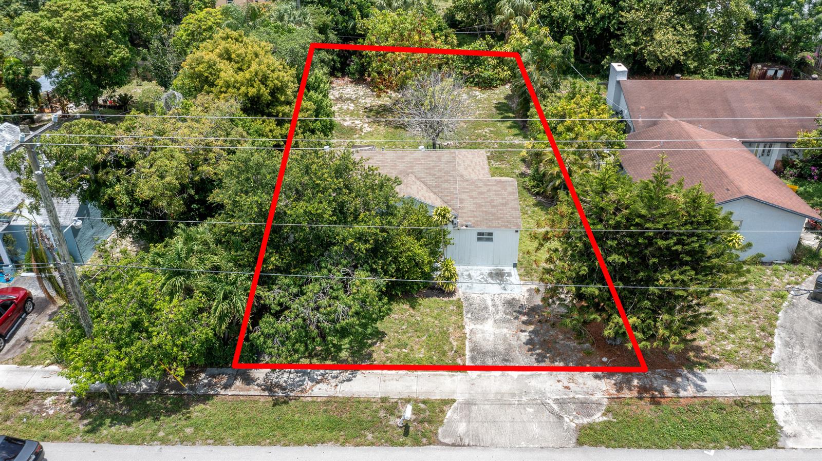 An aerial view shows a single-story house with a driveway and yard outlined in red — 229 SW 4th Avenue, Delray Beach FL 33444, DELRAY BEACH, FL