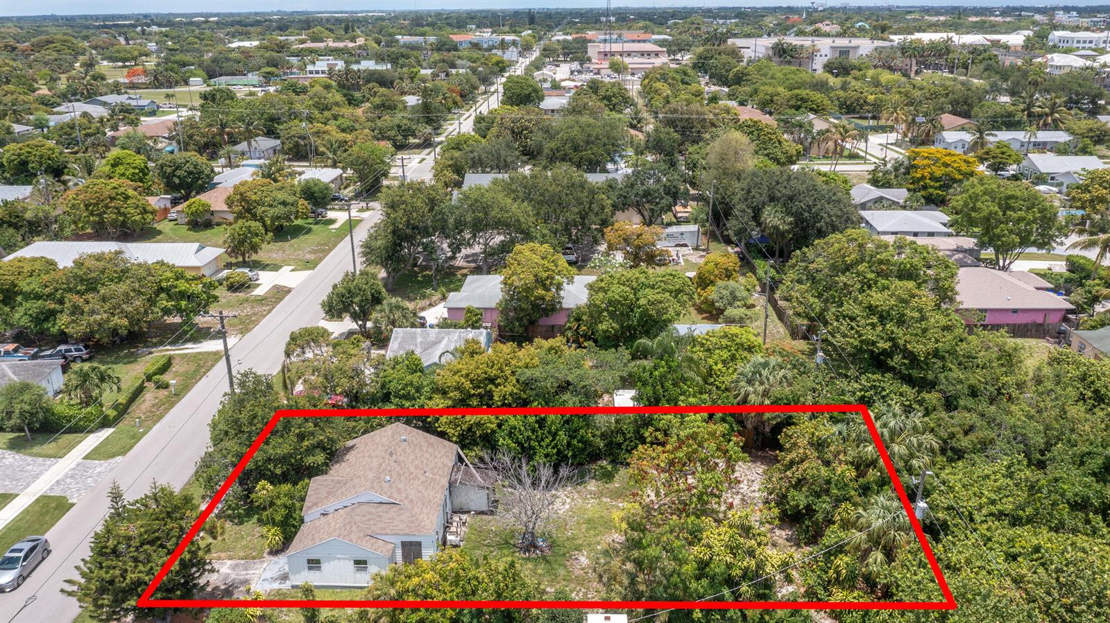 An aerial view shows a single-story house with a large, tree-filled yard outlined in red — 229 SW 4th Avenue, Delray Beach FL 33444, DELRAY BEACH, FL
