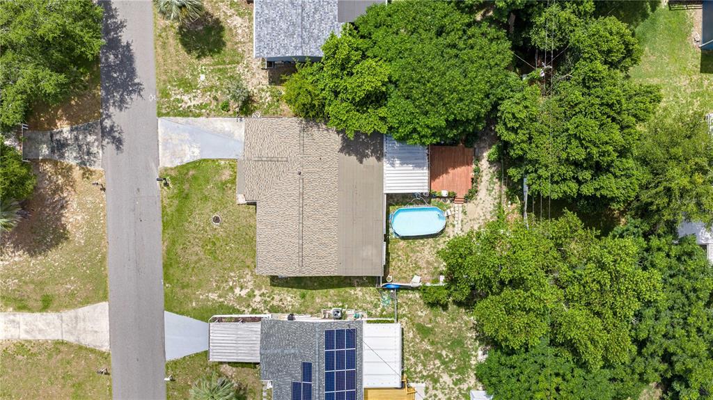 An aerial view shows a house with a small pool and a large tree canopy — 18 E GOLDEN STREET, BEVERLY HILLS, FL