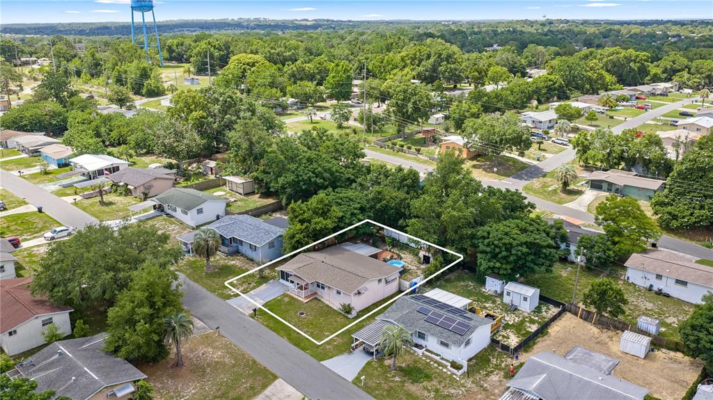 An aerial view shows a single-story house with a white outline on a residential lot — 18 E GOLDEN STREET, BEVERLY HILLS, FL