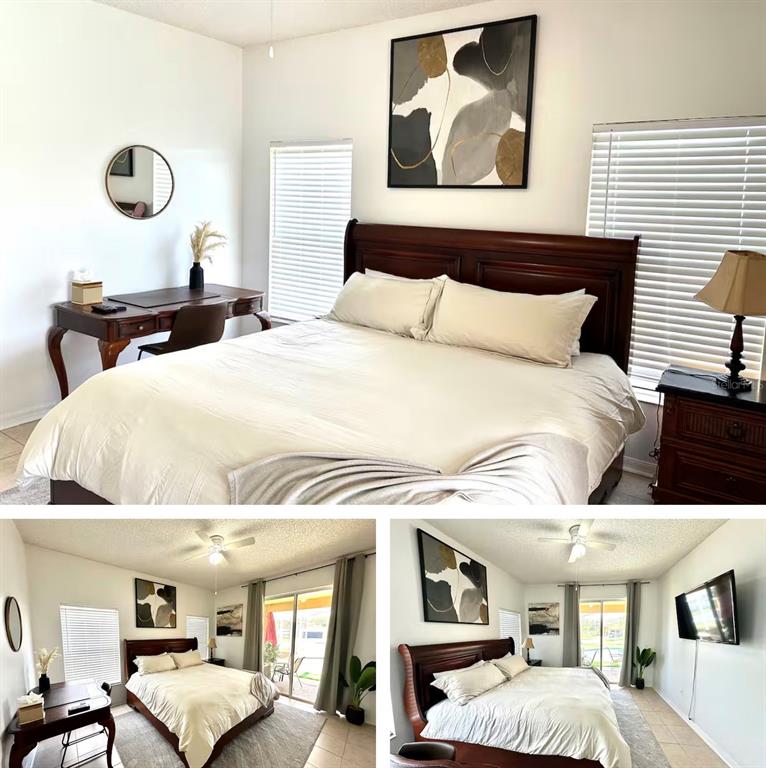 A bedroom features a dark wood bed frame, a desk, and two windows with blinds — 5212 JASMINE TRACE LANE, KISSIMMEE, FL