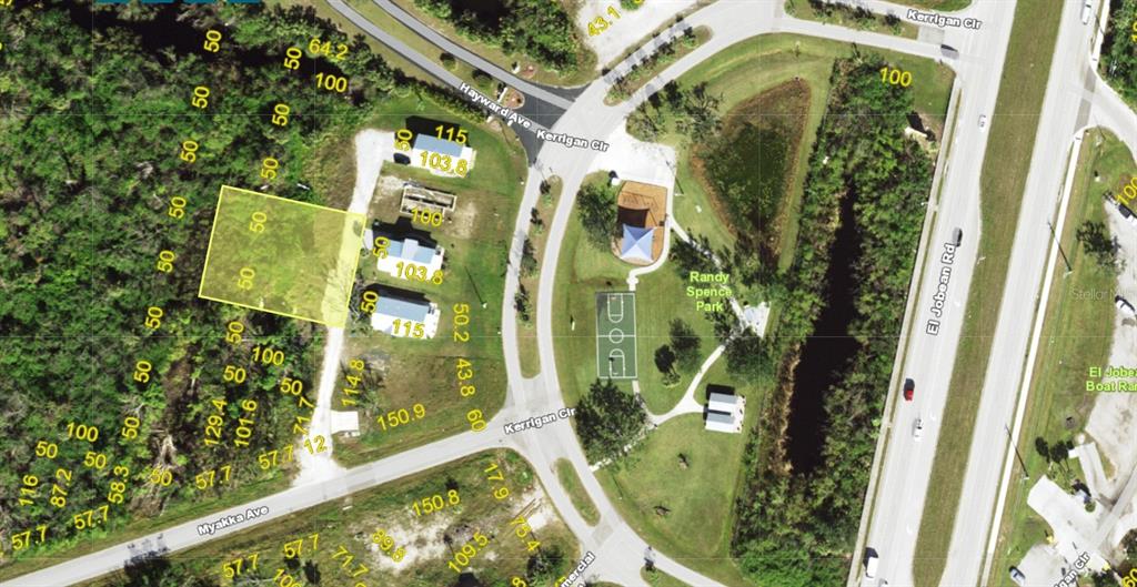 This is an aerial map showing a highlighted residential lot adjacent to a public park — 4457 BUCKWHEAT ROAD, PORT CHARLOTTE, FL