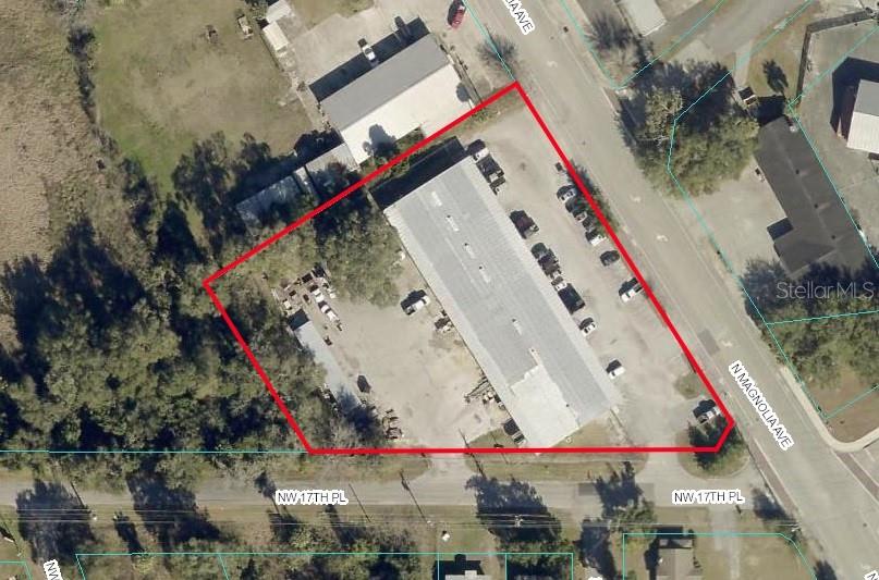 This aerial map shows a commercial property with a warehouse building and parking lot — 1726 N MAGNOLIA AVENUE, OCALA, FL