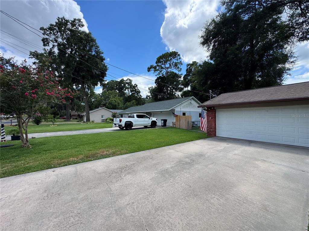 A white pickup truck is parked on a driveway in front of a residential house — 4080 NE 28TH TERRACE, OCALA, FL