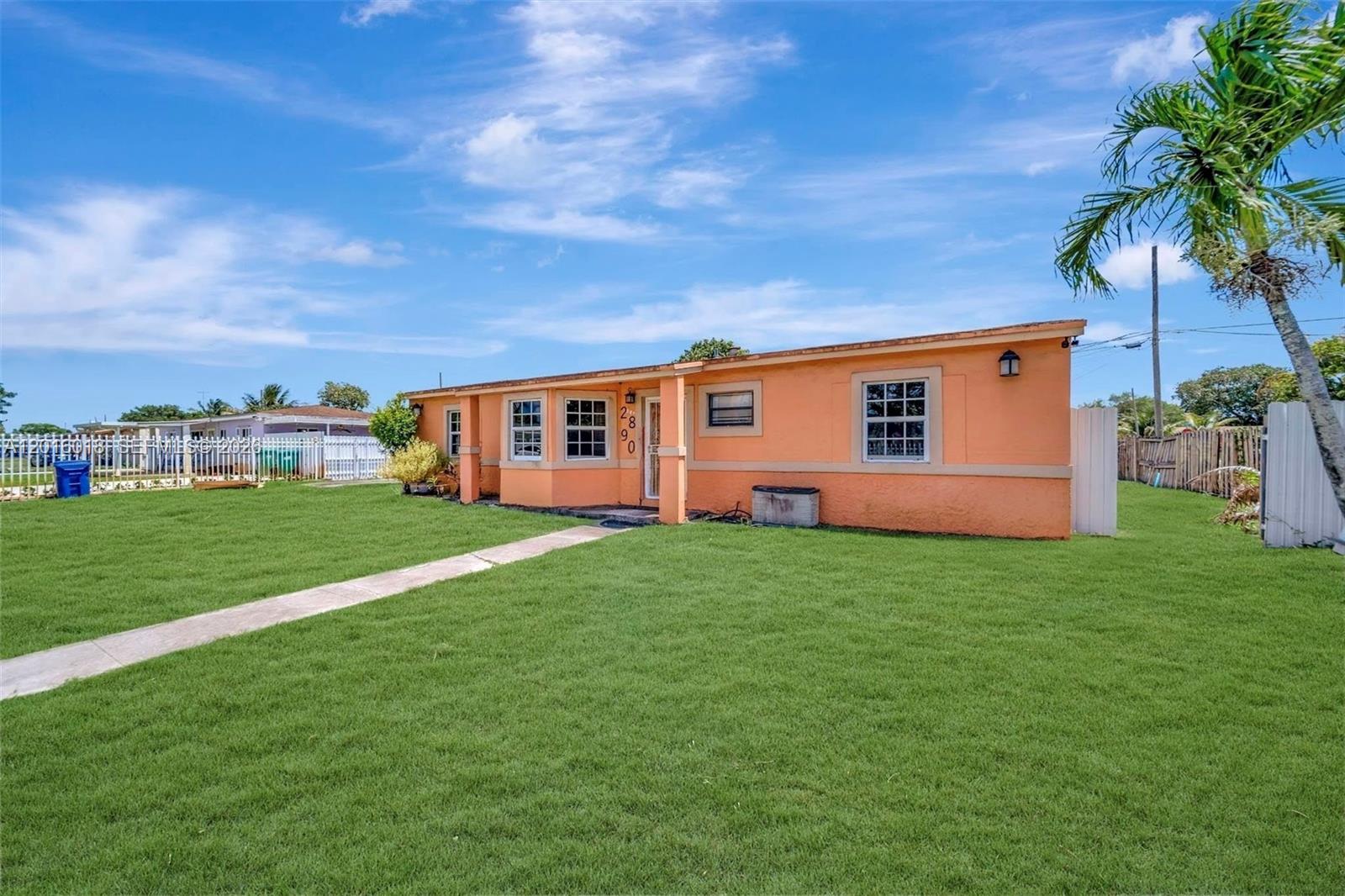 A single-story orange house with a front lawn and a concrete walkway — 2890 NW 160th St, Miami Gardens FL 33054, MIAMI GARDENS, FL