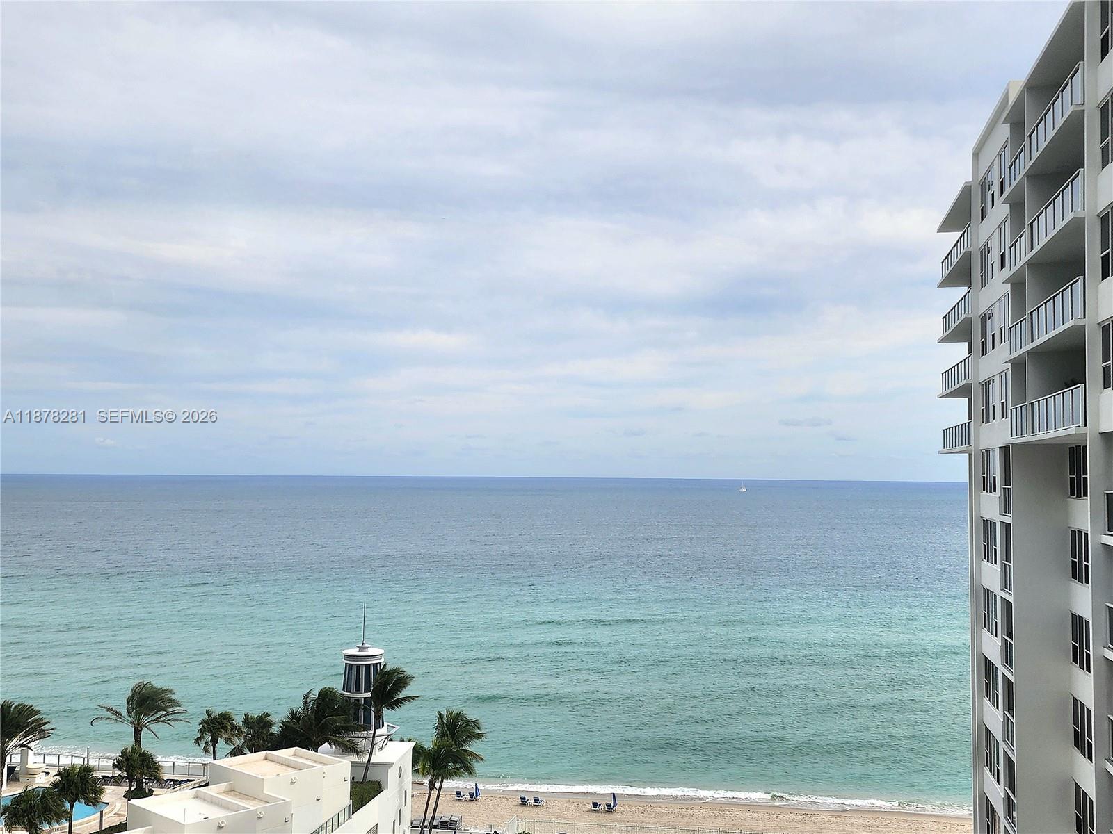 An elevated view of the ocean and beach from a high-rise balcony — 3505 S Ocean Dr # 1006, Hollywood FL 33019, HOLLYWOOD, FL