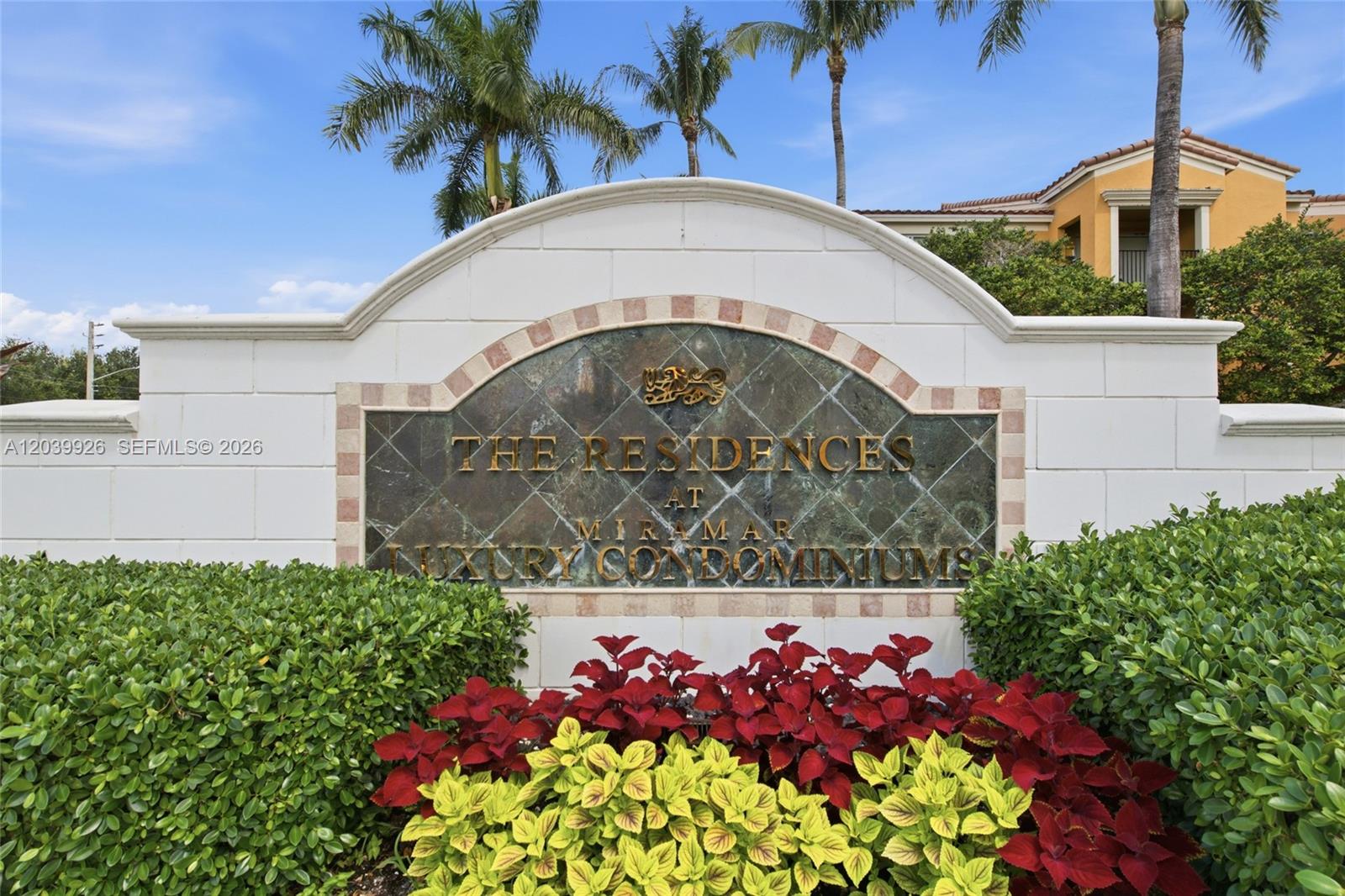 A stone monument sign for The Residences at Miramar stands behind colorful garden landscaping — 2351 W Preserve Way # 306, Miramar FL 33025, MIRAMAR, FL
