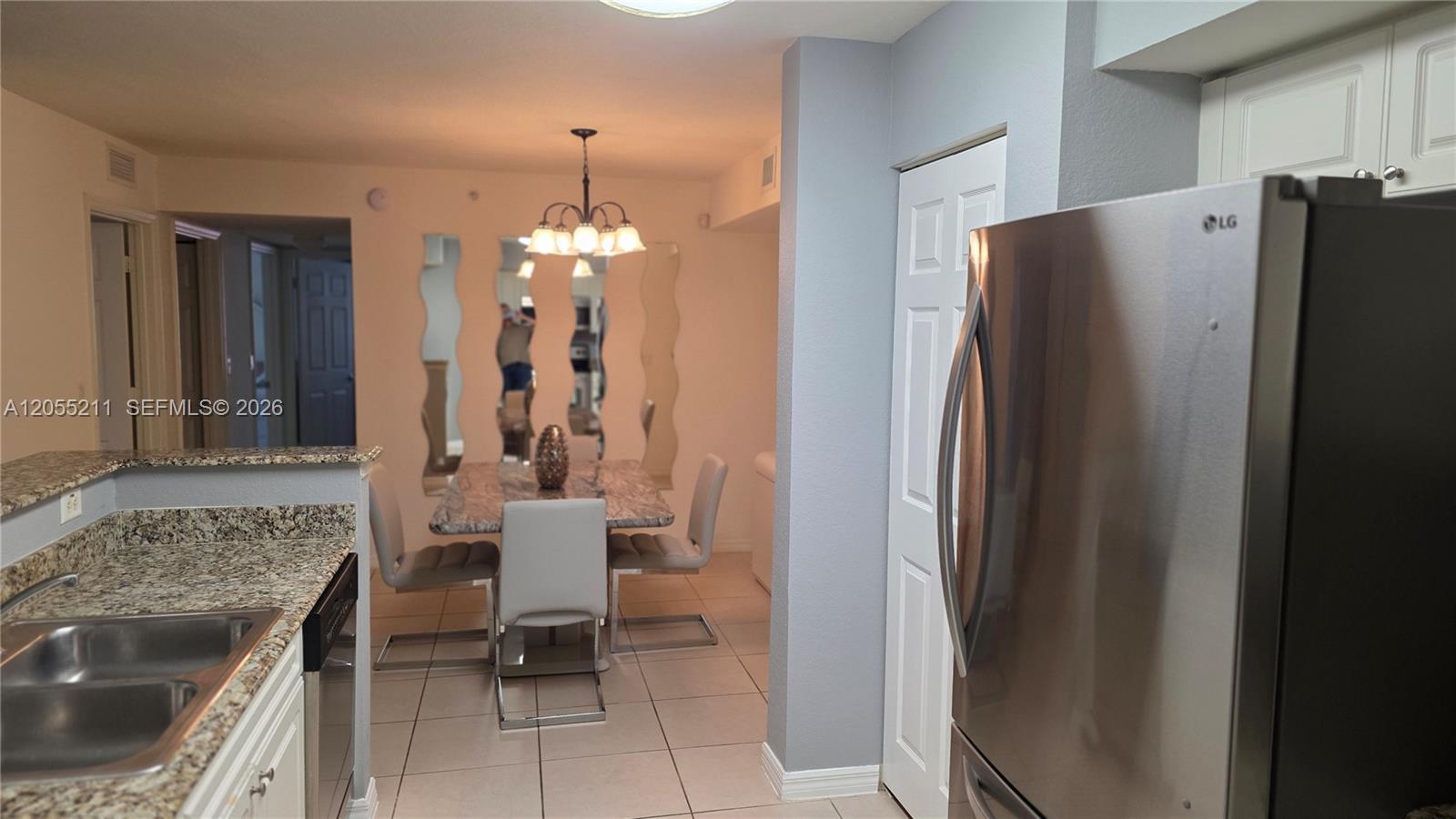 A living room features two white sofas, a black ottoman, and a ceiling fan — 6769 Heritage Grande # 2201, Boynton Beach FL 33437, BOYNTON BEACH, FL