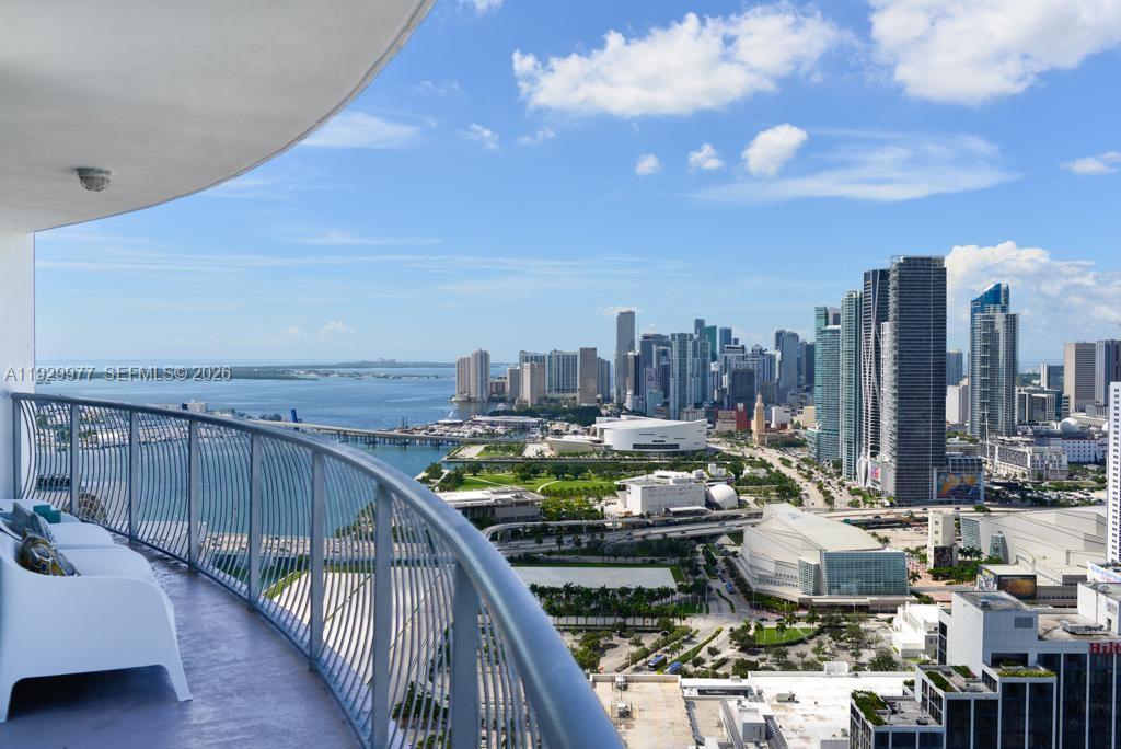 A high-rise balcony overlooks the Miami skyline, Biscayne Bay, and the Kaseya Center — 1750 N Bayshore Dr # 4814, Miami FL 33132, MIAMI, FL
