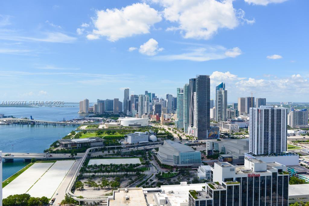An elevated view of the Miami skyline featuring skyscrapers, a bridge, and Biscayne Bay — 1750 N Bayshore Dr # 4814, Miami FL 33132, MIAMI, FL