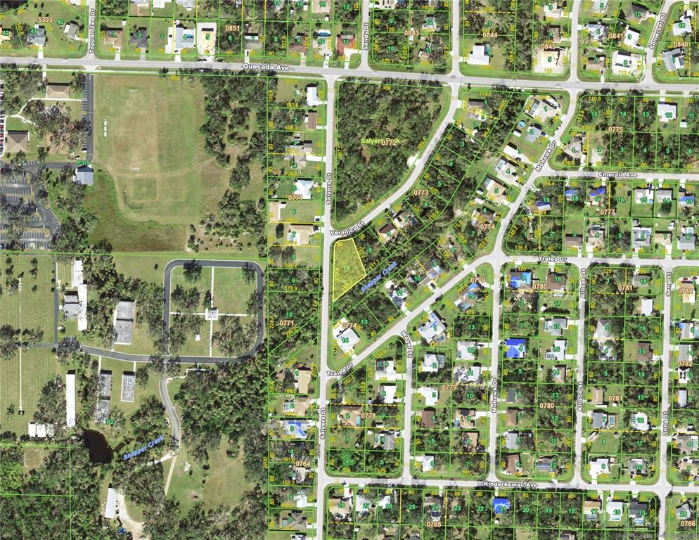 This is an aerial map showing residential lots, streets, and wooded areas — 1328 SALYERS STREET, PORT CHARLOTTE, FL