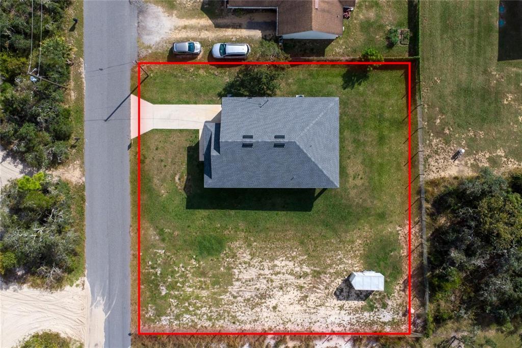 An aerial view shows a house with a gray roof on a rectangular lot — 3842 PHILLIPS ROAD, LAKE WALES, FL