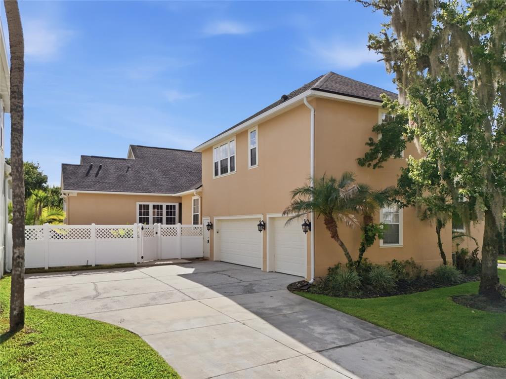 An aerial view shows several suburban houses with swimming pools and driveways in a neighborhood — 1018 WILD ELM STREET, CELEBRATION, FL