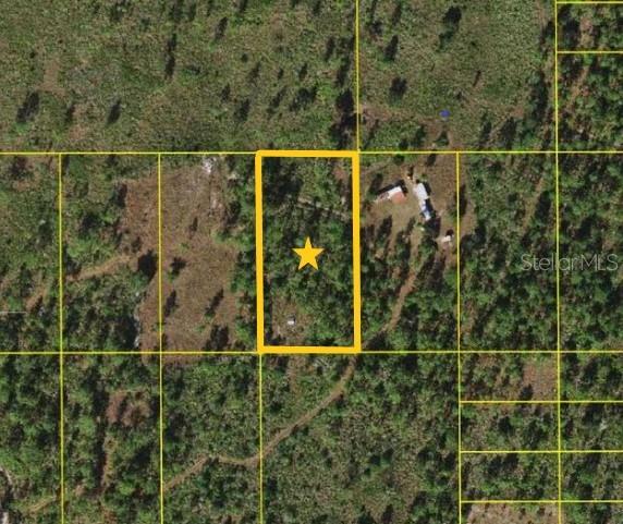This is an aerial map view of a rectangular plot of land marked with a star — SUBURBAN ESTS SEC 35...4424 001J, ST CLOUD, FL