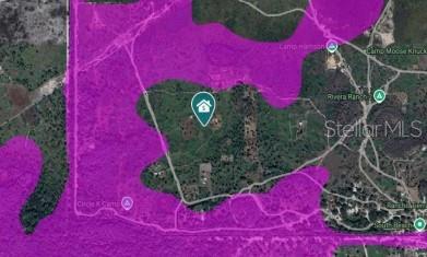 This is a satellite map showing a property boundary highlighted in purple — SUBURBAN ESTS SEC 35...4424 001J, ST CLOUD, FL