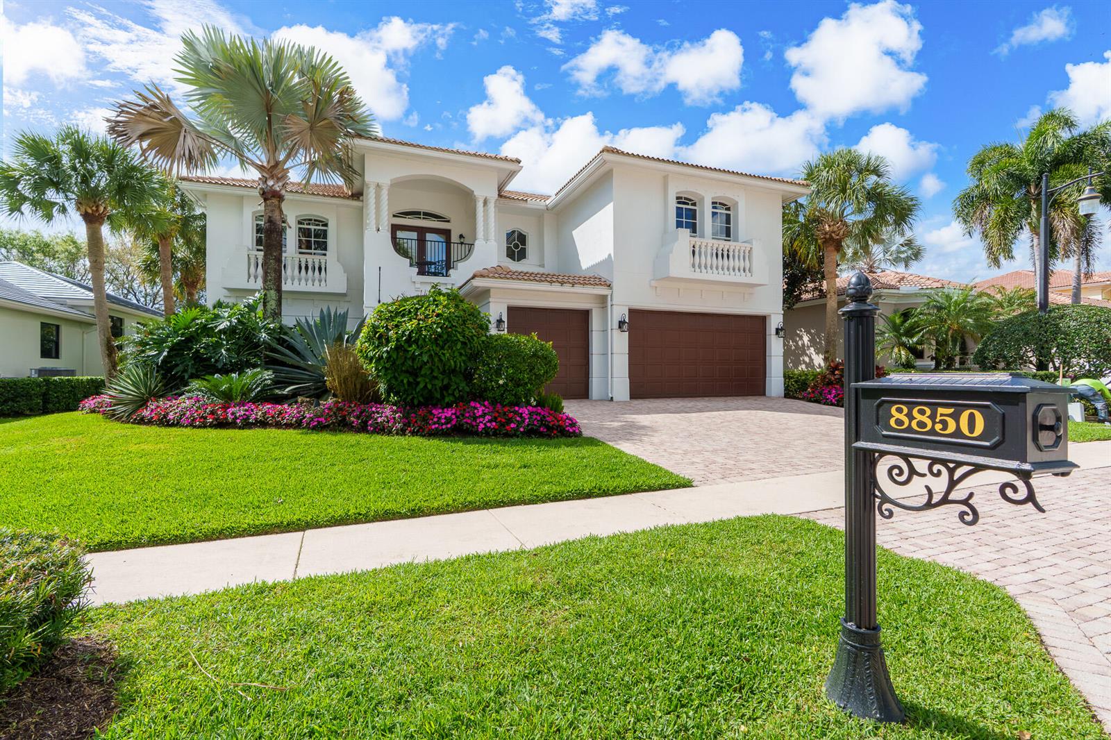 A two-story white stucco house with a brown garage and a landscaped front yard — 8850 Valhalla Drive, Delray Beach FL 33446, DELRAY BEACH, FL