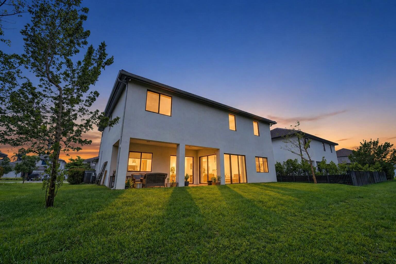 A house exterior features a paved driveway, a three-car garage, and stone veneer accents — 13025 Addilyn Court, Davie FL 33325, DAVIE, FL