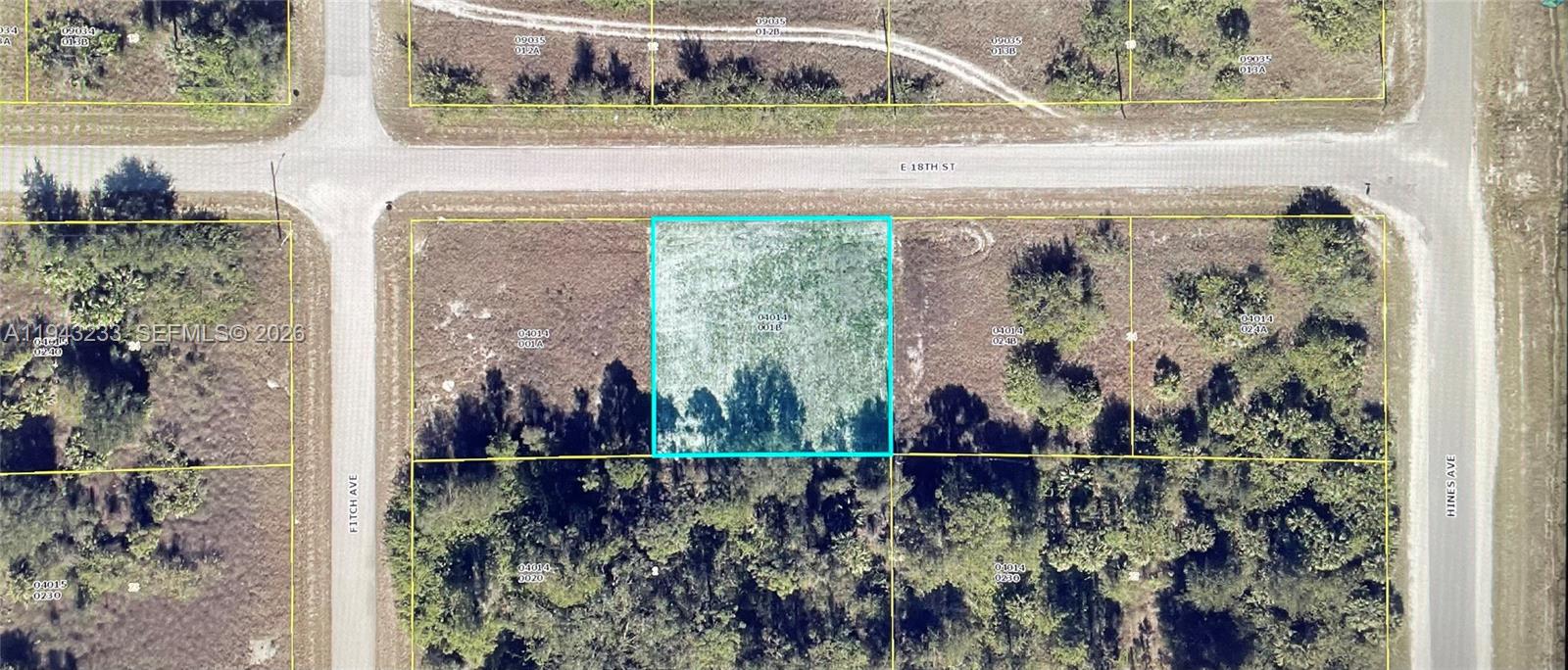 This is an aerial map view of a vacant, rectangular lot highlighted in blue — 4502 E 18TH ST, Lehigh Acres FL 33972, LEHIGH ACRES, FL