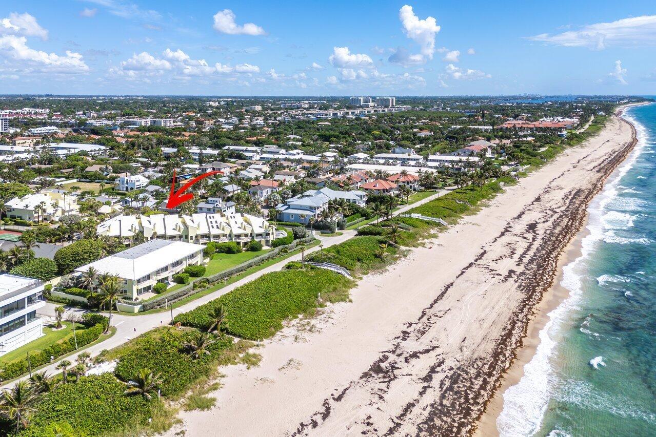 An aerial view of a beachfront residential complex with a red arrow pointing toward buildings — 5109 N Ocean E Boulevard, Ocean Ridge FL 33435, OCEAN RIDGE, FL