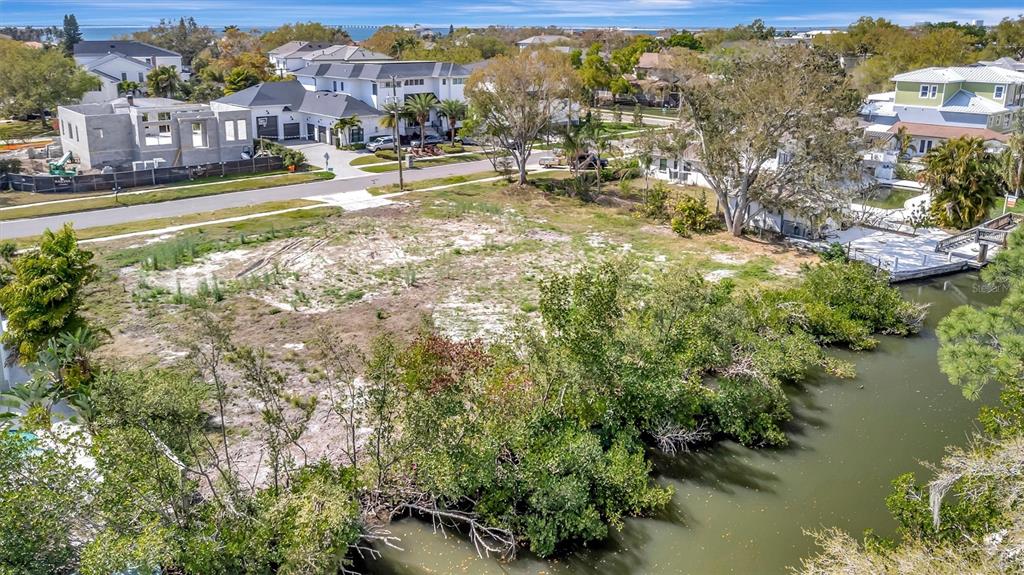 An aerial view shows a vacant waterfront lot with mangroves bordering a canal — 2618 S DUNDEE STREET UNIT PARCEL A, TAMPA, FL