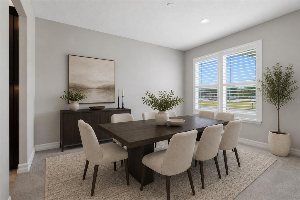 A dining room features a dark wood table, six beige chairs, and a matching sideboard — 10760 TIBBETT STREET, ORLANDO, FL