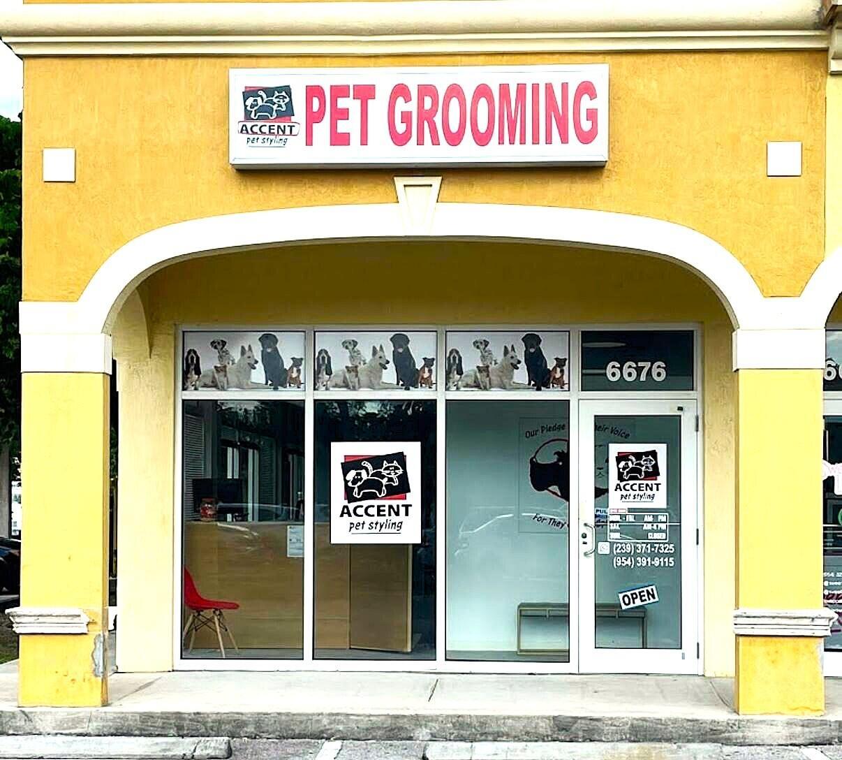 The exterior of a yellow commercial storefront features a pet grooming sign and glass doors — 6676 Stirling Road, Hollywood FL 33024, HOLLYWOOD, FL