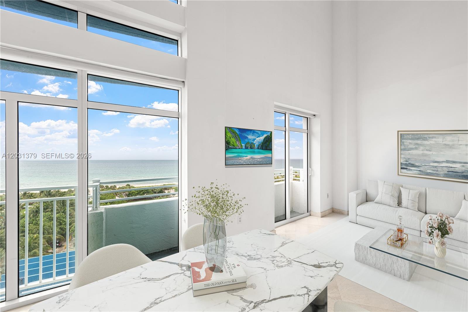 A bright living and dining area features floor-to-ceiling windows with an ocean view — 7600 Collins Ave # 1210, Miami Beach FL 33141, MIAMI BEACH, FL