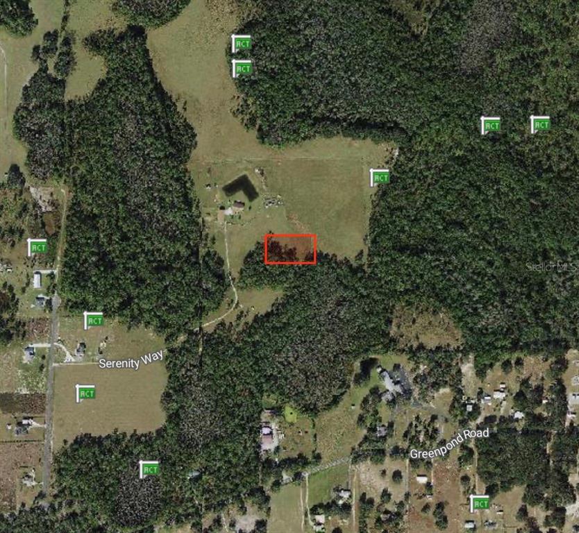This is an aerial map showing a plot of land with a highlighted red rectangle — POLK CITY, POLK CITY, FL