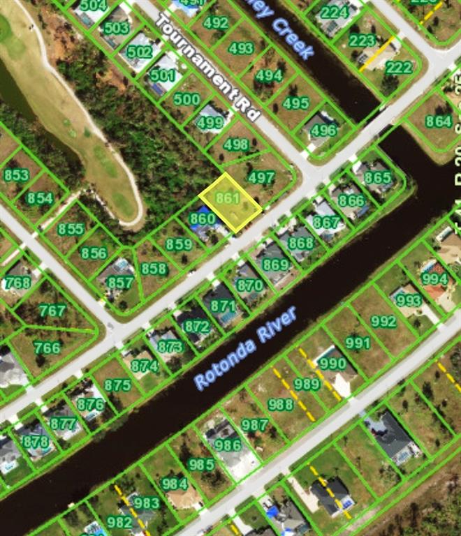 This is an aerial map showing a vacant residential lot highlighted in yellow — 1054 ROTONDA CIRCLE, ROTONDA WEST, FL