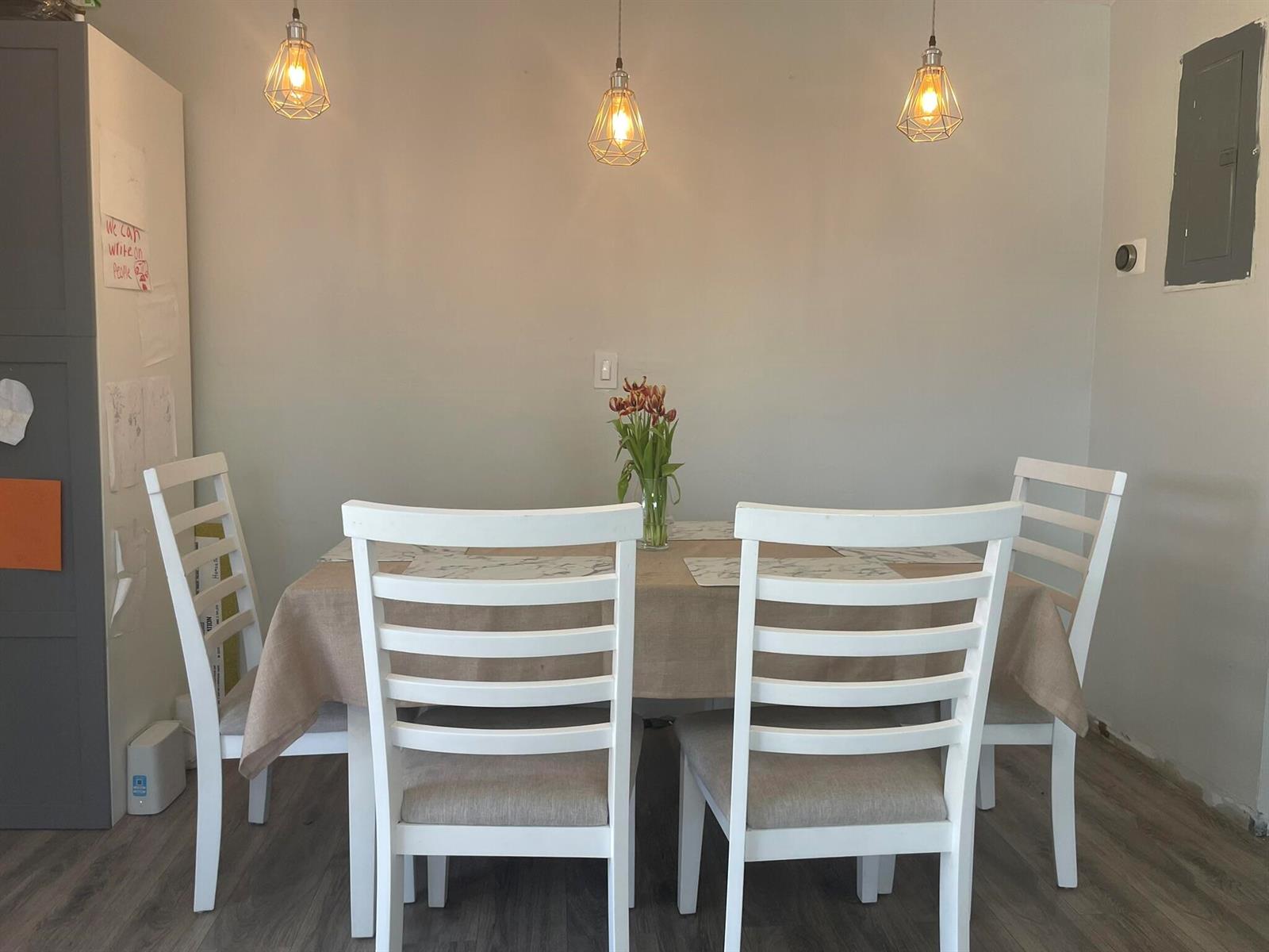 A dining room features a table with four white chairs under three hanging pendant lights — 3650 SW 59th Terrace # 80, Davie FL 33314, DAVIE, FL