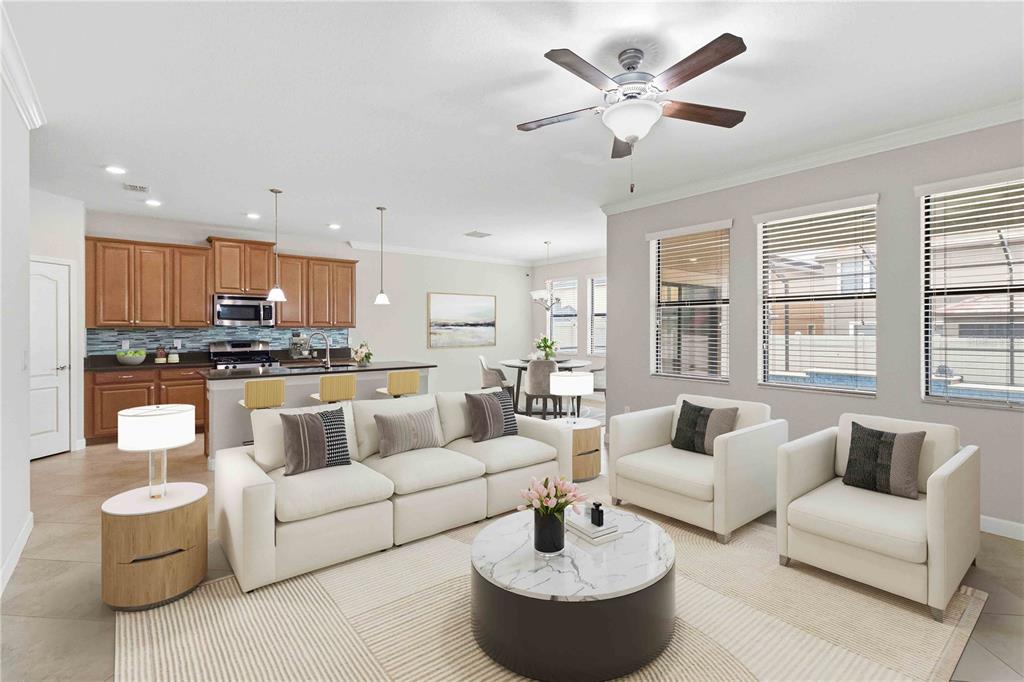 An open-concept living room and kitchen featuring white furniture, a marble coffee table, and cabinetry — 1001 OLIVETO VERDI COURT, BRANDON, FL