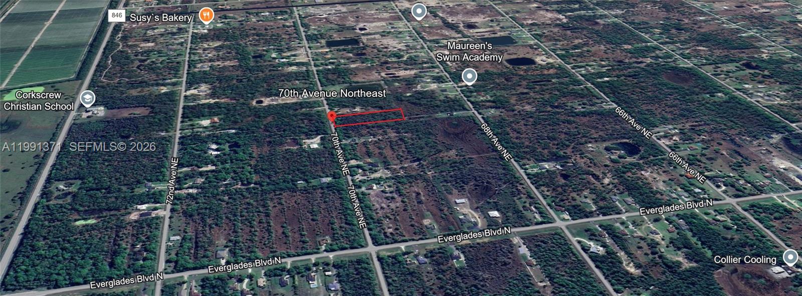 This is an aerial map showing a rectangular plot of land highlighted in red — 2844 70th Ave NE, Naples FL 34120, NAPLES, FL