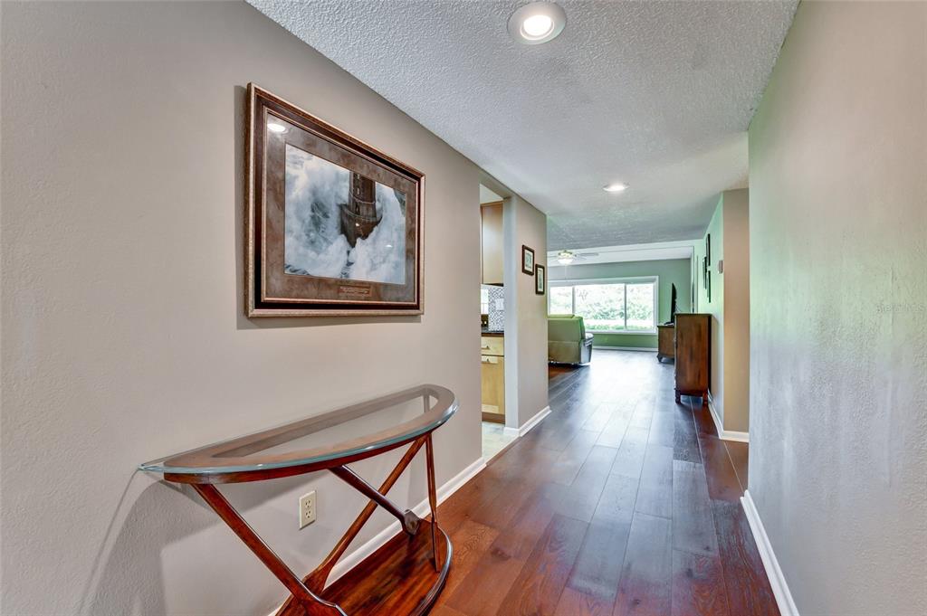 This is a floor plan of a single-story home with three bedrooms and two bathrooms — 8107 BARDMOOR PLACE UNIT 103, SEMINOLE, FL