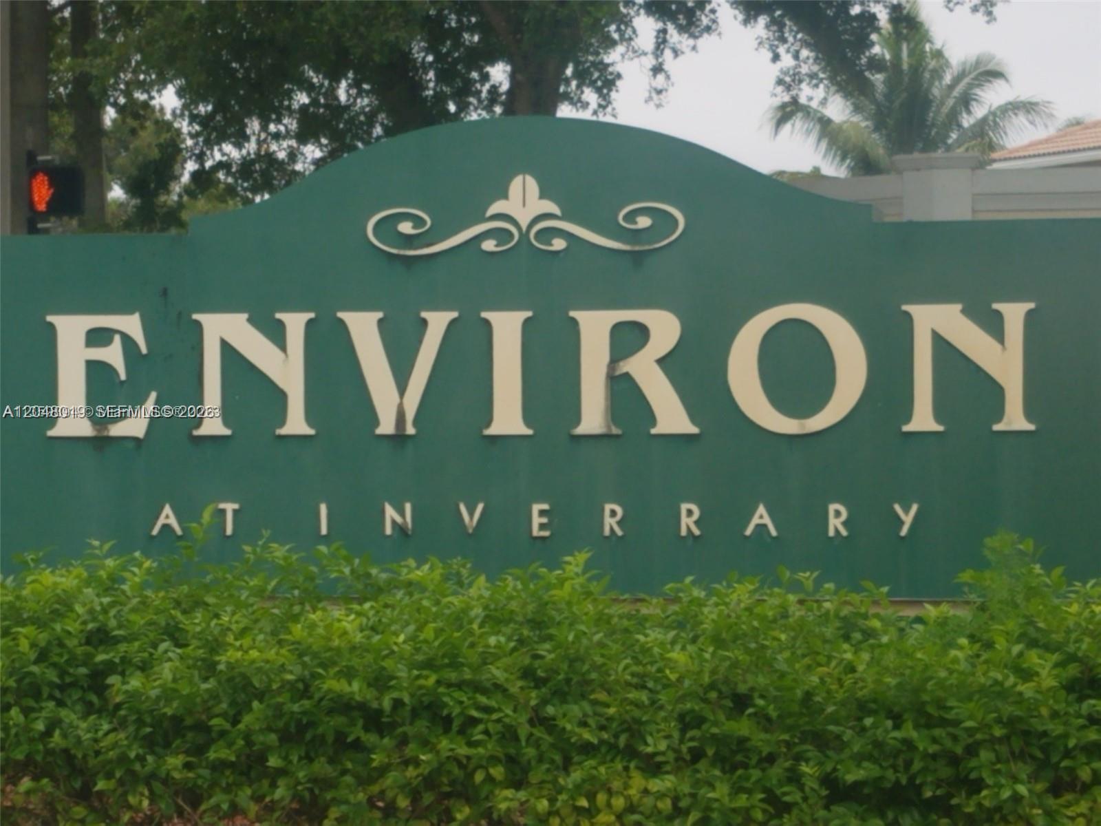 A green sign with white lettering reads Environ at Inverrary, surrounded by green bushes — 6921 Environ Blvd # 4P, Lauderhill FL 33319, LAUDERHILL, FL