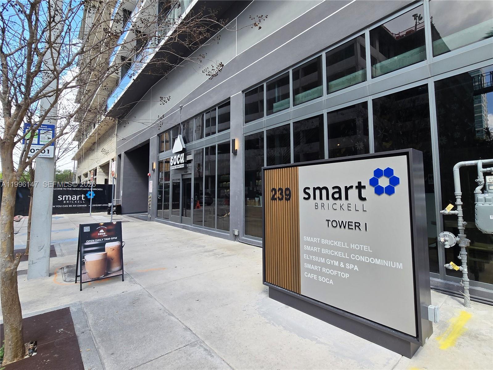 The exterior of a modern building features a prominent sign for Smart Brickell Tower I — 239 SW 9th St # 1403, Miami FL 33130, MIAMI, FL