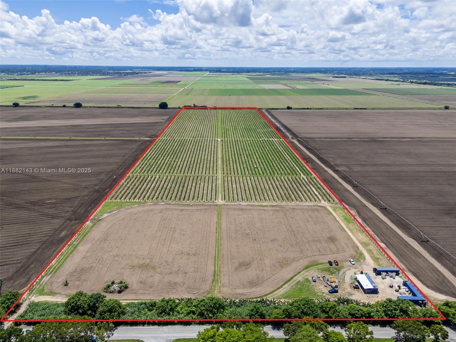 An aerial view shows a rectangular agricultural plot with rows of crops and outbuildings — SW MIAMI-DADE, Miami FL 33196, MIAMI, FL