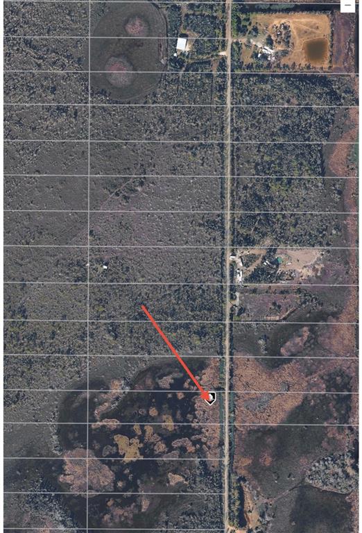 An aerial map view shows a rural property with a road and surrounding vegetation — 33892 OIL WELL ROAD, PUNTA GORDA, FL