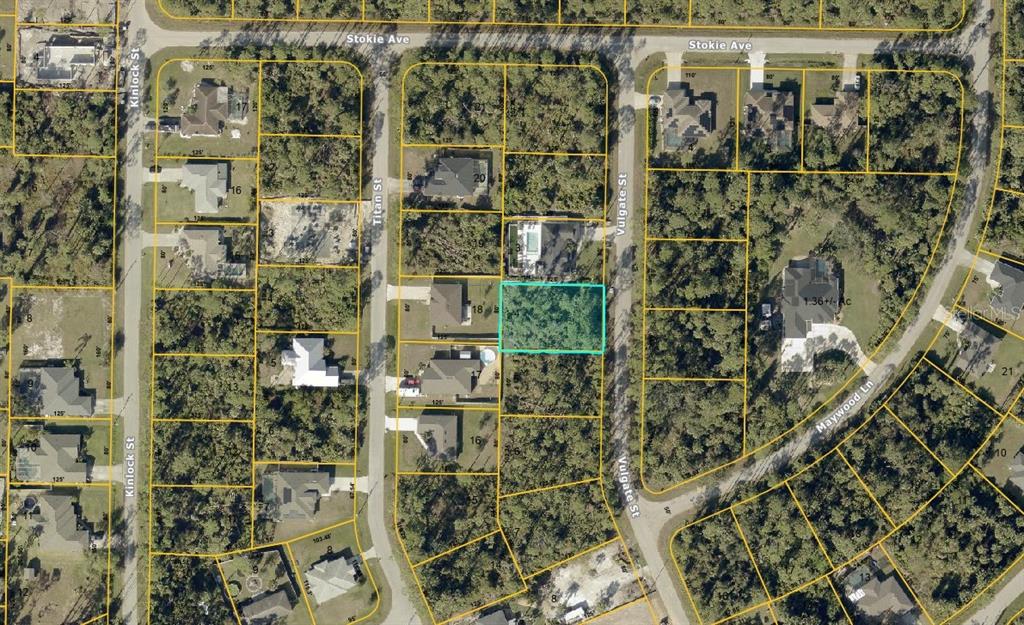 This is an aerial map showing a vacant, rectangular residential lot highlighted in light blue — VULGATE STREET, NORTH PORT, FL