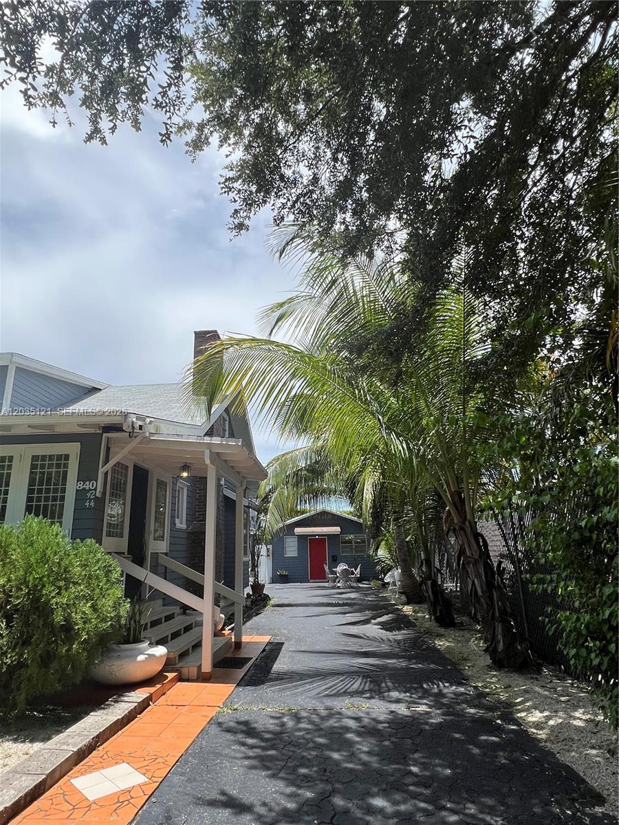 A blue house with a front porch and a detached garage with a red door — 840 SW 13th Ave, Miami FL 33135, MIAMI, FL