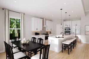 This is a rendering of a modern kitchen and dining area with white cabinetry — 22174 PINE GROVE LOOP, LEESBURG, FL