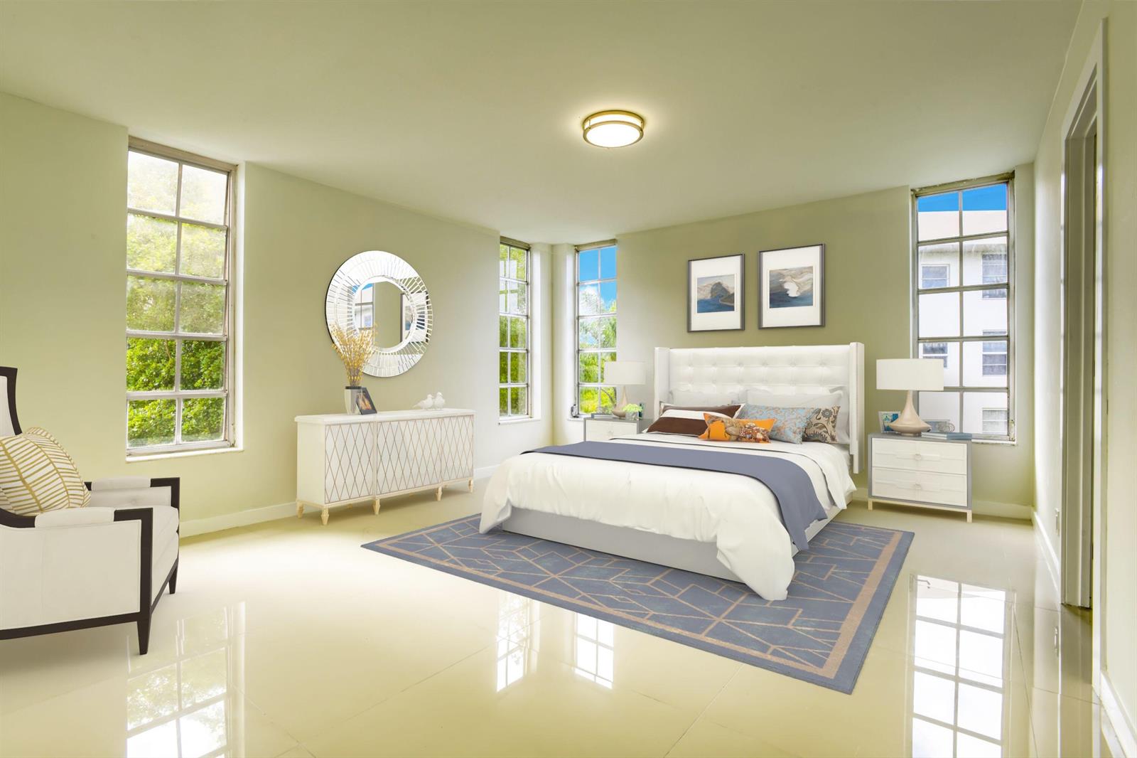 A bedroom with light green walls, a white tufted headboard, and large windows — 535 Oaks Drive # 510, Pompano Beach FL 33069, POMPANO BEACH, FL