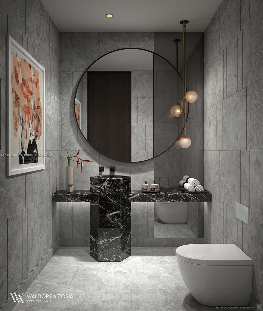 This rendering shows a modern bathroom featuring a black marble pedestal sink and gray tile — 300 N Biscayne Blvd # 8602, Miami FL 33132, MIAMI, FL