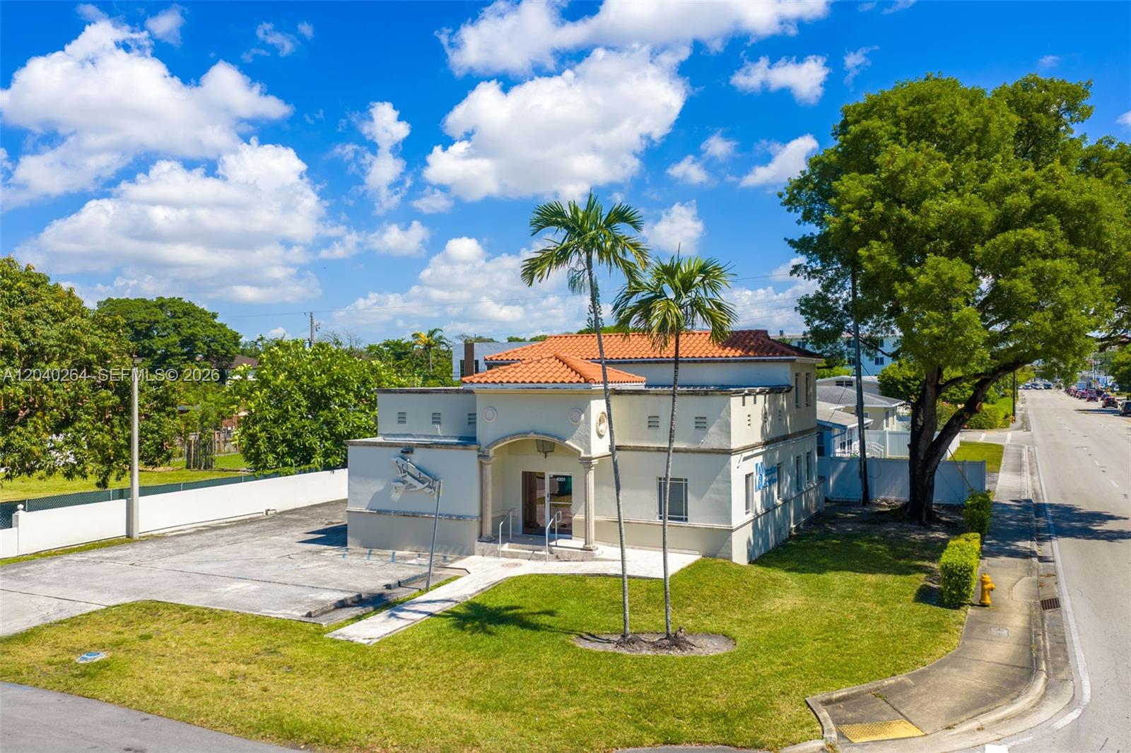 A two-story stucco building with a tiled roof sits on a corner lot — 4201 SW 11th St, Miami FL 33134, MIAMI, FL