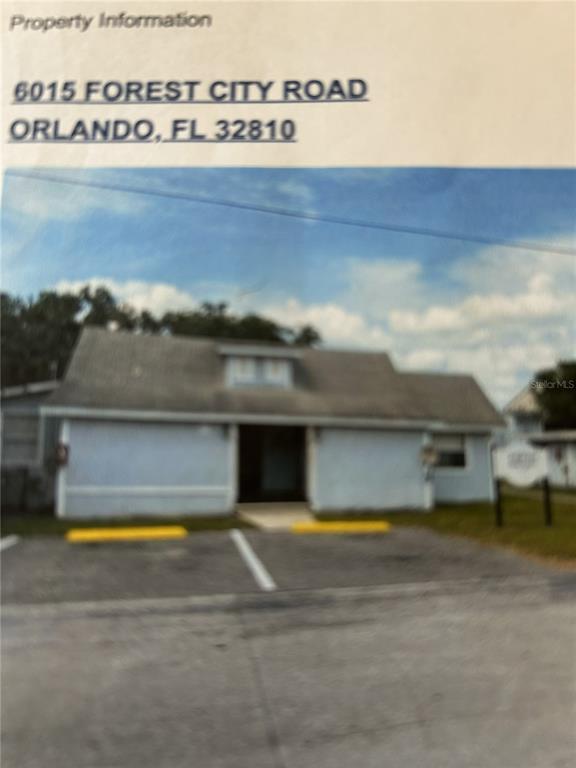 A single-story building with a gray roof and a parking lot in front — 6015 FOREST CITY ROAD, ORLANDO, FL