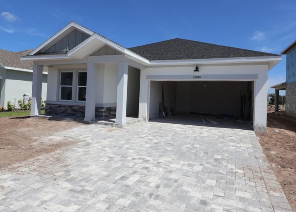 This floor plan shows a single-story home with three bedrooms, two bathrooms, and a garage — 10665 CRESCENT CREEK CROSSING, PARRISH, FL