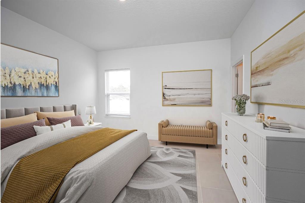 A bedroom features a bed with a mustard throw, a white dresser, and a bench — 14587 SW 25TH TER, OCALA, FL 34473, OCALA, FL
