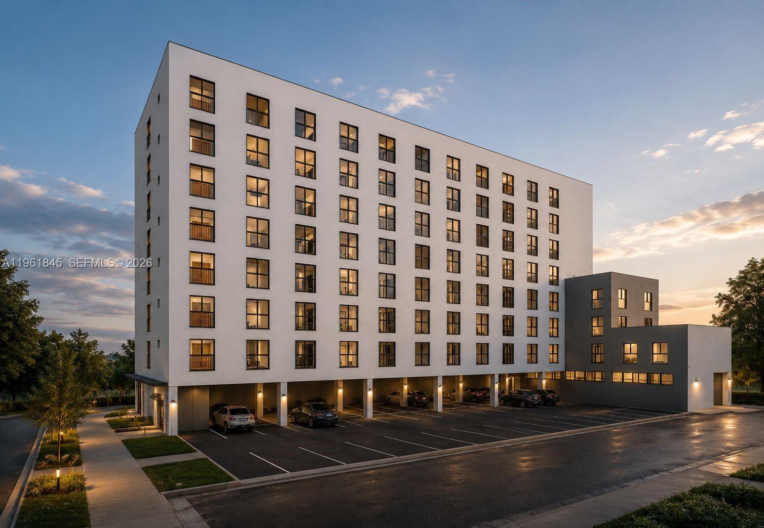 This is a rendering of a modern multi-story apartment building with covered ground-level parking — 0 216 St, Miami FL 33177, MIAMI, FL