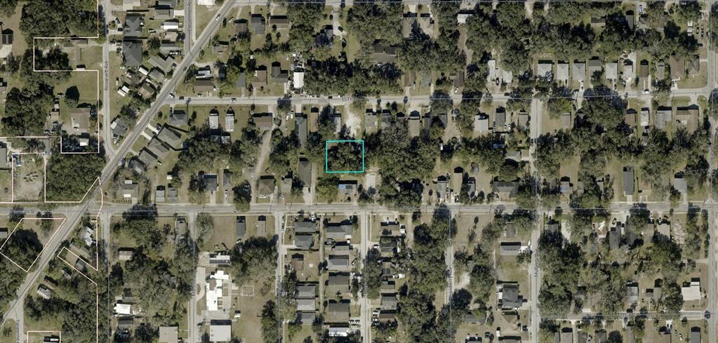 This aerial map shows a vacant, tree-covered residential lot highlighted by a light blue rectangle — 34-19-30-5AK-0A00-0470 INACCESSIBLE TRACK, SANFORD, FL