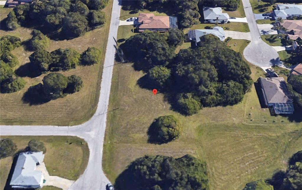 This aerial view shows a vacant residential lot marked with a red pin — 109 WAYNE ROAD, ROTONDA WEST, FL